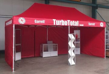 6x3m QUICKUPTENT ALU-HEXAGON Faltzelt-Infostand mit Volantbranding im 4c-Digitaldruck